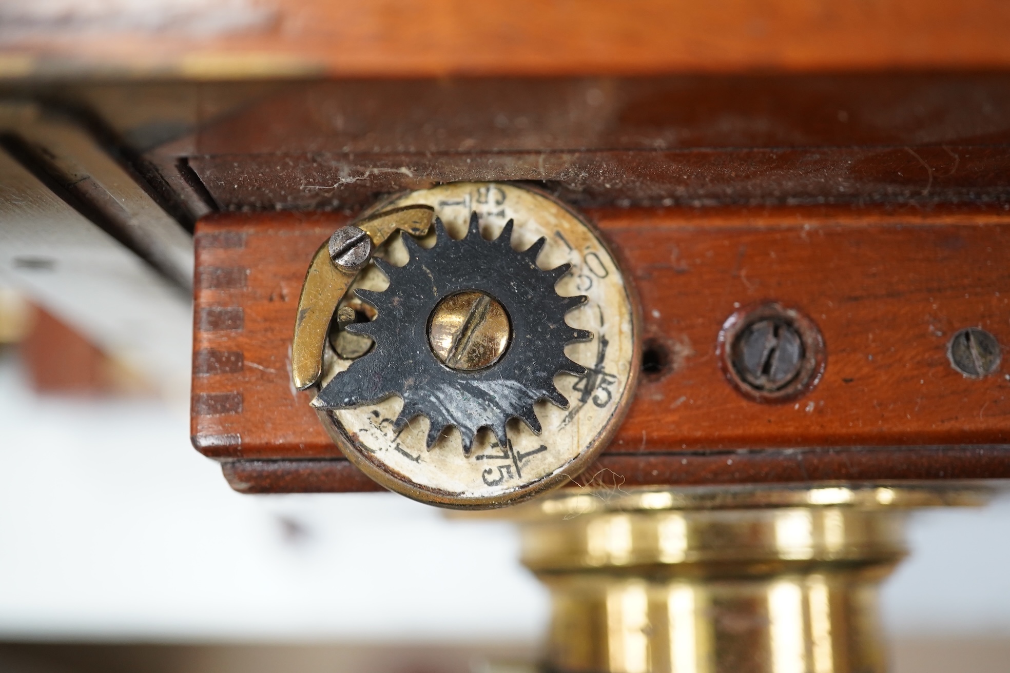 A late 19th/early 20th century brass and mahogany half plate bellows camera with a lens and a shutter action by Thornton Pickard. Condition - glass missing